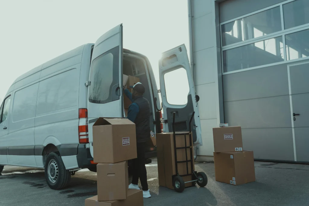 Logistics van being loaded for efficient last-mile e-commerce delivery.