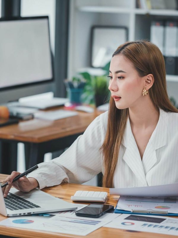 asian-woman-sitting-at-a-desk-working-in-the-office-use-a-computer-laptop.jpg